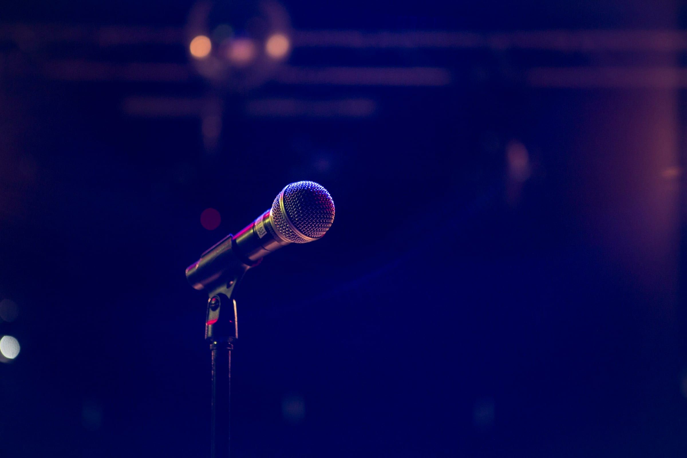 Wireless microphone on a stand under blue stage light